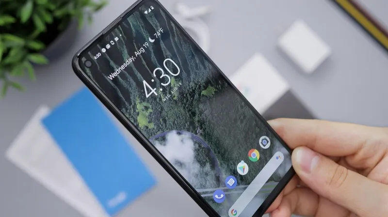 A hand holding a cell phone